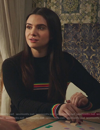 Jane's black rainbow striped sweater on The Bold Type