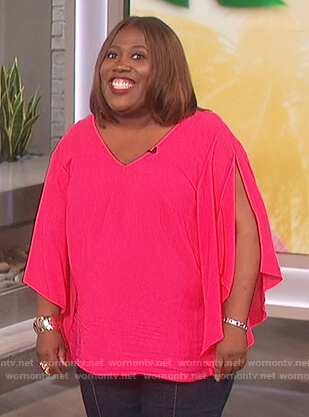 Sheryl’s pink split sleeve top on The Talk