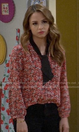 Sofia's red floral top with black tie on Young and Hungry