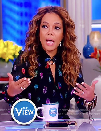 Sunny’s black feather print wrap dress on The View