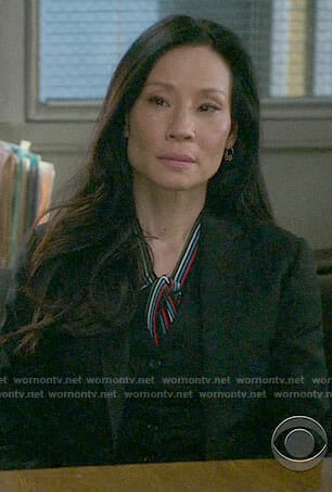 Joan's striped tie-neck blouse on Elementary