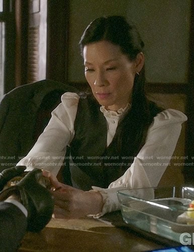 Joan’s white ruffled trim blouse on Elementary