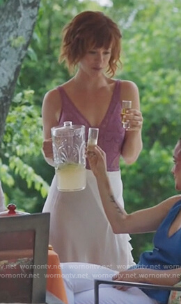 Kelly Anne's purple lace swimsuit and white wrap skirt on Queen of the South