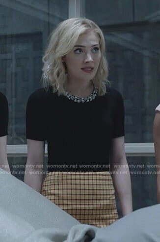 The Frost Sisters’ black pearl embellished top and yellow mini skirt on The Gifted