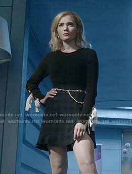 The Frost Sisters' black bow sleeve top and checked mini skirt on The Gifted