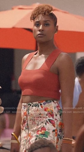 Issa's orange crop top and floral skirt on Insecure