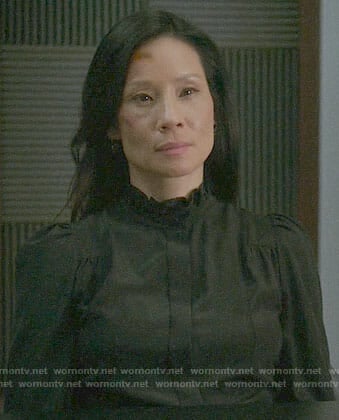 Joan’s black ruffled neck blouse on Elementary