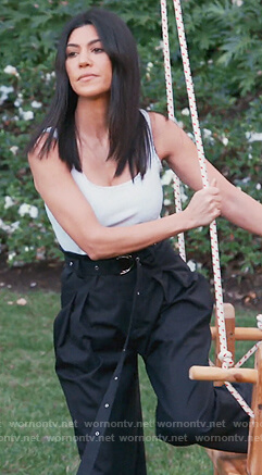 Kourtney's navy high waist belted pants on Keeping Up with the Kardashians
