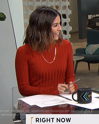 Erin’s red ribbed sweater on Live from E!