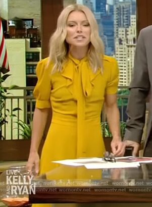 Kelly’s yellow tie neck a-line dress on Live with Kelly and Ryan