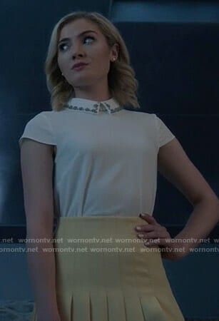 The Frost Sisters' white embellished collar top and pleated mini skirt on The Gifted