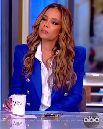 Sunny’s blue button embellished blazer on The View