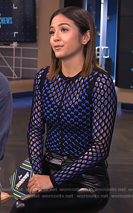 Erin’s black and blue knit top on E! News
