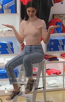 Kendall's pink Adidas tee and fringe jeans on Keeping Up with the Kardashians