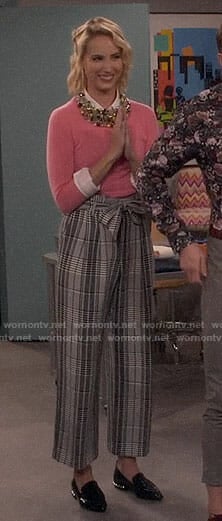 Mandy’s pink sweater and plaid trousers on Last Man Standing