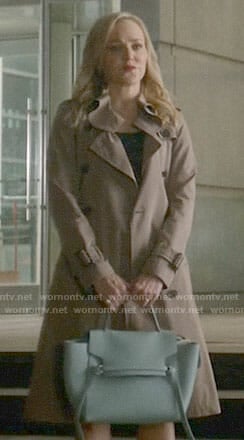 Marissa’s trench coat and blue bag on Bull