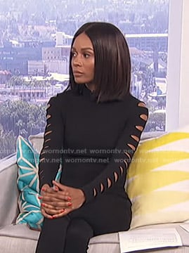 Zuri’s black cutout sleeve top on Live from E!