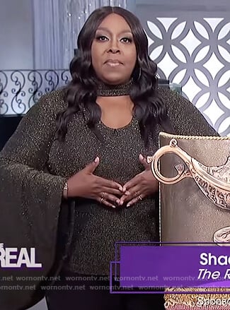 Loni’s black metallic bell sleeve top on The Real