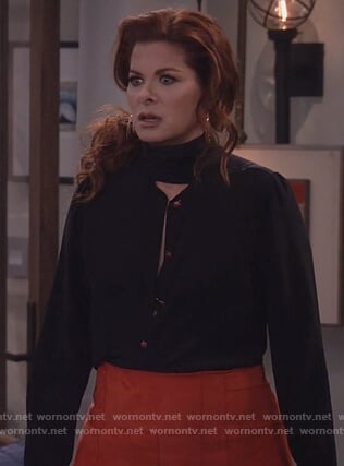 Grace’s black tie neck blouse and red suede skirt on Will and Grace