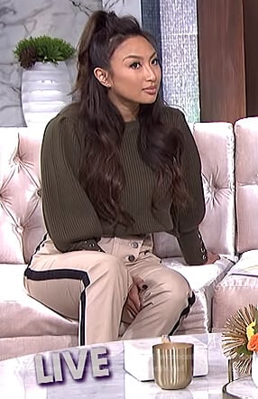 Jeannie’s green lace-up cuff sweater and stripe pants on The Real