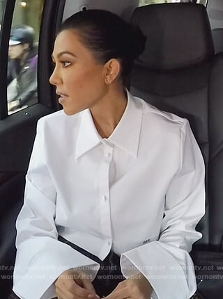 Kourtney's white bell sleeve cropped top on Keeping Up with the Kardashians