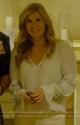 Debra's white v-neck embellished top on Dirty John