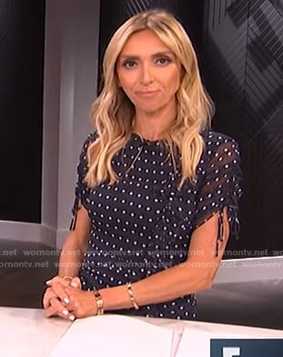 Giuliana’s navy polka dot ruffled dress on E! News