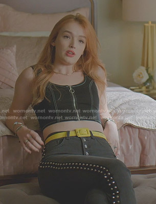 Kirby's cropped zip front top and studded jeans on Dynasty
