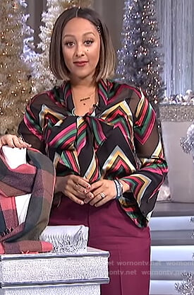 Tamera’s black striped sheer blouse on The Real