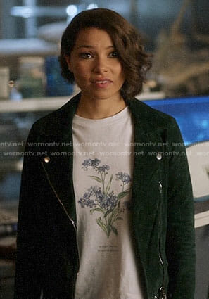 Nora’s flower tee and green suede jacket on The Flash