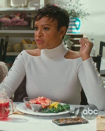 Angela's white studded cold shoulder top on American Housewife