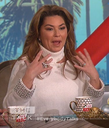Shania Twain’s white embellished cuffs cutout sweater on The Talk