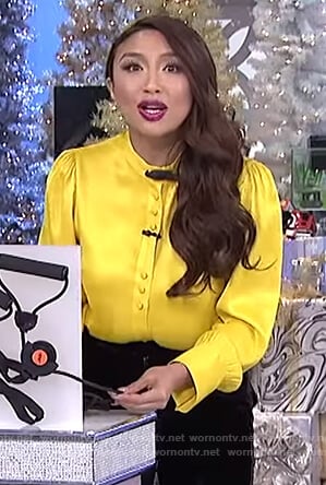 Jeannie's yellow satin button up blouse on The Real