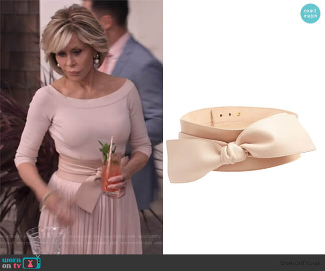 Wide bow-embellished leather waist belt by Alexander McQueen worn by Grace (Jane Fonda) on Grace and Frankie