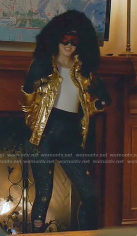 Kirby’s gold down jacket and galaxy print leggings on Dynasty