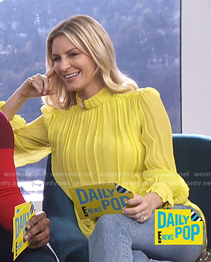 Morgan’s yellow pleated mock neck blouse on E! News Daily Pop