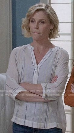 Claire’s white striped top on Modern Family