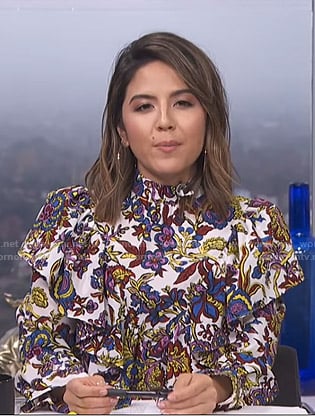 Erin’s white floral ruffled blouse on E! News Daily Pop