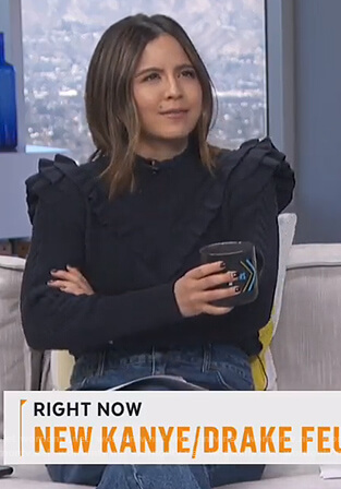 Erin’s navy ruffle trim sweater on Live from E!