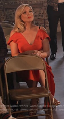 Brianna’s red cold shoulder asymmetric dress on Grace and Frankie