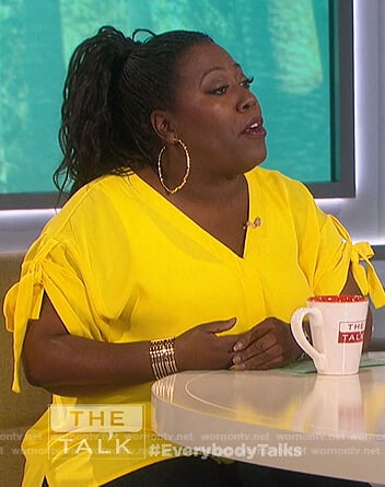 Sheryl’s yellow tie sleeve top on The Talk