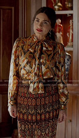 Cristal's metallic printed tie neck blouse and pleated skirt on Dynasty
