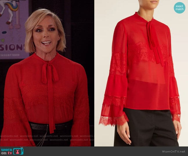 Jacqueline’s red tie neck blouse on Unbreakable Kimmy Schimidt