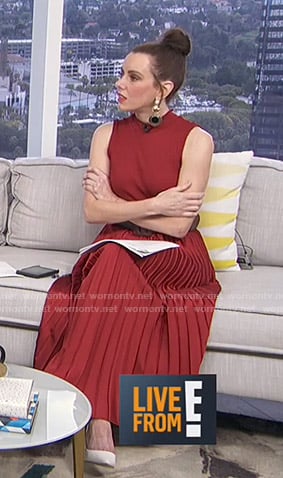 Melanie’s red pleated sleeveless dress on E! News Daily Pop