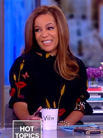 Sunny’s black floral high neck blouse on The View