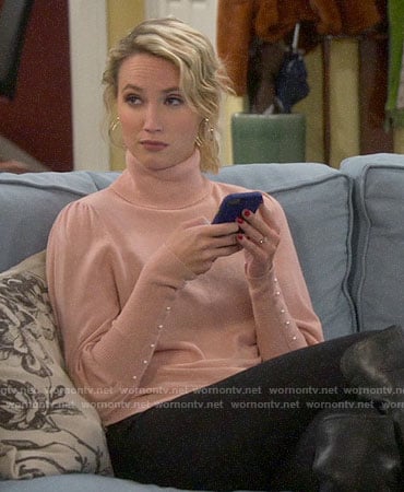 Mandy's pink puff sleeve sweater with pearl buttons on Last Man Standing