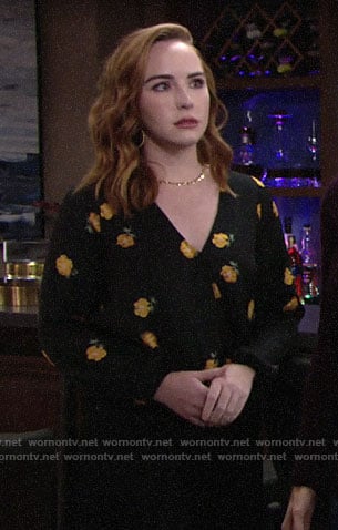 Mariah’s black and orange floral blouse on The Young and the Restless