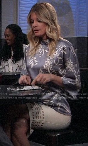 Nina's blue-grey floral blouse and white cutout skirt on General Hospital