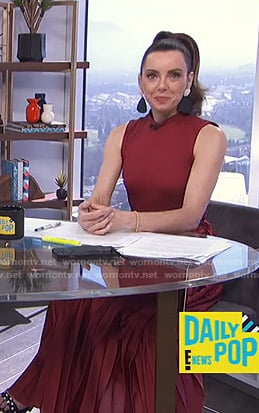 Melanie’s red pleated sleeveless dress on E! News Daily Pop