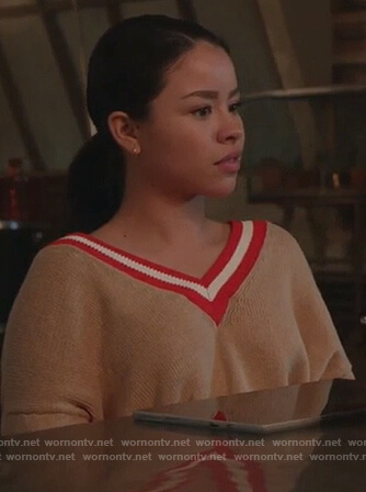 Mariana’s beige striped v-neck sweater on Good Trouble